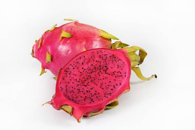 Red-skinned dragon fruit with red flesh and black seeds 