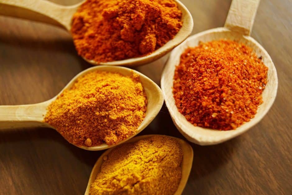 Spoonfuls of turmeric spices