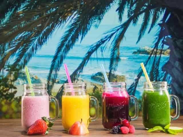 Different types of kidney-friendly smoothies in glass gars