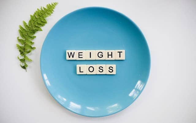 A plate with weight loss written using letters
