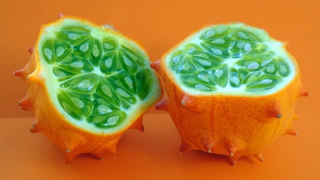 A kiwano/horned melon sliced into two